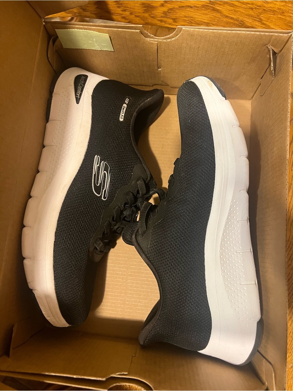 Skechers Black and White Slip-On Sneakers